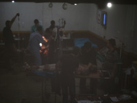 
Medics tend to an injured men inside a field hospitalafter what activists said was mortar shelling by forces of Syria's President Bashar a...