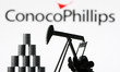 ConocoPhillips company logo and miniature models of an oil derrick pump and oil barrels ar...
