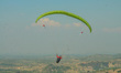Paragliders fly with Indonesian flags to commemorate 76th Independence Day of the Republic...