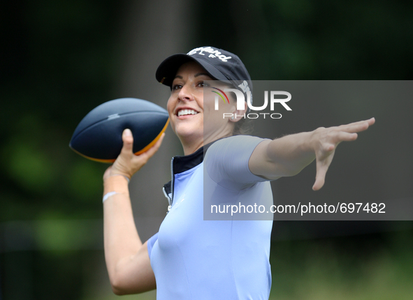 Paige Mackenzie throws a ball to the fans in the gallery at the 14th green after finishing the hole during the second round of the Marathon...