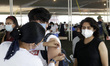A teenager receives the COVID-19 vaccine booster dose of Pfizer administered inside of Xoc...