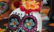 Decorated skull amongst offerings during the Day of the Dead celebrations in Toronto, Onta...