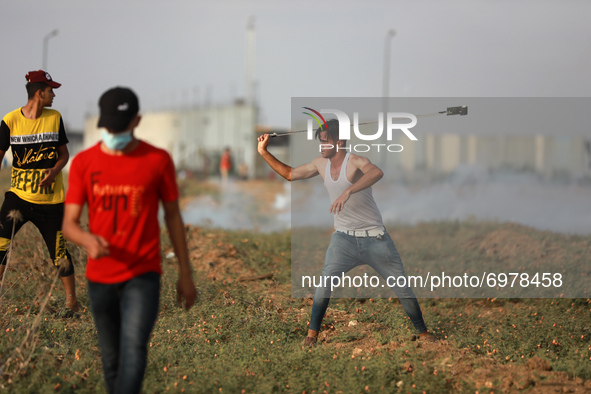 Palestinian protesters during a demonstration by the border fence with Israel, east of Gaza City, denouncing the Israeli siege of the Palest...