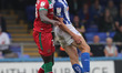 Hartlepool United's Will Goodwin contests a header with Walsall's Rollin Menayese during...