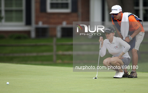 Sarah Jane Smith lines up her putt flanked by her husband and caddy, Duane Smith, at the 14th green during the second round of the Marathon...