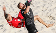 Anatoliy Ryabko of Belarus and Eliott Mounoud (in front) of Switzerland vie for the ball d...
