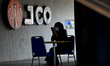 A woman waiting order food at a outlet donut and coffee in Bogor, West Java, Indonesia on...