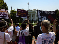 People attend a rally and protest hosted by the League of Women Voters and People For the American Way near the White House on August 24, 20...