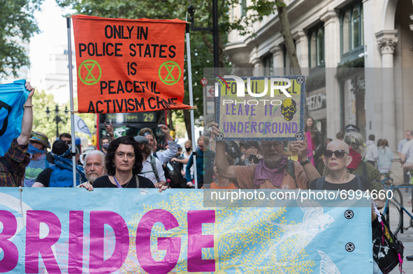 LONDON, UNITED KINGDOM - AUGUST 25, 2021: Environmental activists from Extinction Rebellion march through central London on the third day of...