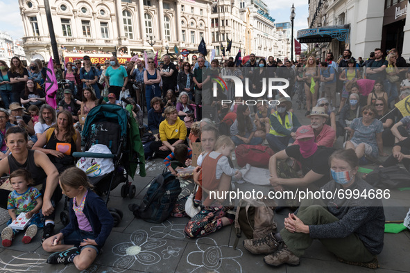 LONDON, UNITED KINGDOM - AUGUST 25, 2021: Environmental activists from Extinction Rebellion and young children gather in Piccadilly Circus o...