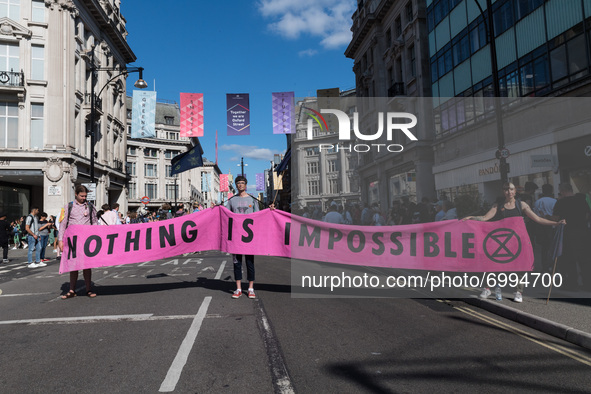 LONDON, UNITED KINGDOM - AUGUST 25, 2021: Environmental activists from Extinction Rebellion demonstrate on Oxford Street on the third day of...