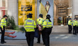 LONDON, UNITED KINGDOM - AUGUST 25, 2021: Police officers carry an environmental activists...