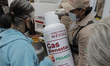 Gas Bienestar workers deliver gas cylinders to residents of the El Vergel neighborhood in...