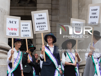 LONDON, UNITED KINGDOM - AUGUST 27, 2021: Suffragettes join environmental activists from Extinction Rebellion outside Bank of England for a...