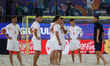 Switzerland head coach Angelo Schirinzi (R) and his players react after losing the FIFA Be...