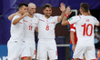 Glenn Hodel (2nd L) of Switzerland celebrates his goal with Sandro Spaccarotella (L), Phil...