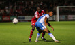 Joel Mumbongo of Accrington Stanley in action with Remeao Hutton  during the EFL Trophy ma...
