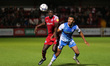 Joel Mumbongo of Accrington Stanley in action with Remeao Hutton  during the EFL Trophy ma...