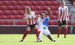 Emma Kelly of Sunderland and Saffron Jordan of Blackburn Rovers in action during the FA Wo...
