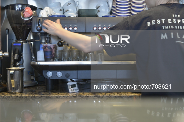 A member of Cafe Nero staff preparing a drink for a customer on Saturday 16th May 2015 in Manchester. 