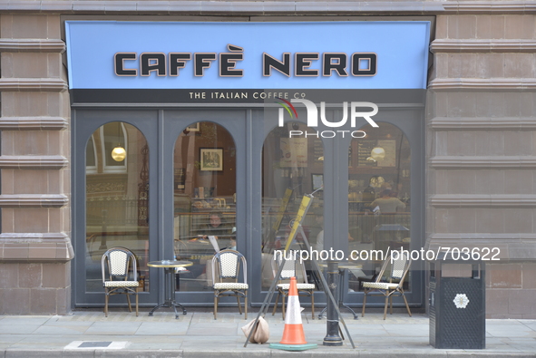 Road furniture standing outside a Cafe Nero coffee shop on Saturday 16th May 2015 in Manchester. 