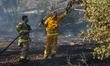 BEIT SHEMESH, July 24, 2015 () -- Israeli fire fighters quench hotspots caused by a confla...