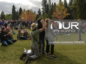 Local supporters of the People's Party of Canada seen in front of a counter-protester who is filming with his mobile phone during Maxime Ber...