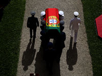 Portuguese military personnel carries the flag-drapped coffin of the late former Portuguese President Jorge Sampaio into the Jeronimos Monas...