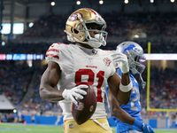 San Francisco 49ers wide receiver Trent Sherfield (81) scores a touchdown during the first half of an NFL football game against the Detroit...