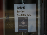 The "Covid-19 Vaccine Available Here" sign seen on the front door of an Edmonton pharmacy.
Alberta has declared a state of public health eme...