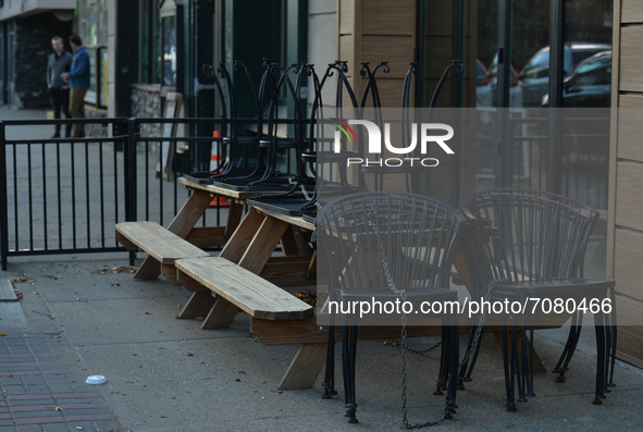 Folded tables and chairs outside a restaurant on Whyte Avenue in Edmonton.
Alberta has declared a state of public health emergency and will...