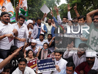 Activists of the Indian Youth Congress (IYC) party shout slogans as they take part in a protest against the rising unemployment while markin...