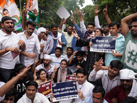 Activists of the Indian Youth Congress (IYC) party shout slogans as they take part in a protest against the rising unemployment while markin...