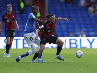 Jamie Sterry of Hartlepool United battles with Oldham Athletic's Dylan Bahamboula  during the Sky Bet League 2 match between Oldham Athletic...
