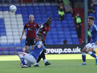 Hartlepool United's Olufela Olomola in action with Alan Sheehan of Oldham Athletic  during the Sky Bet League 2 match between Oldham Athleti...