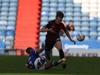 Jordan Clarke of Oldham Athletic tackles Hartlepool United's Reagan Ogle   during the Sky Bet League 2 match between Oldham Athletic and Har...