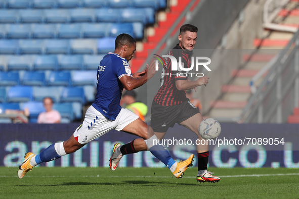  Jordan Clarke of Oldham Athletic in action with Hartlepool United's Luke Molyneux during the Sky Bet League 2 match between Oldham Athletic...