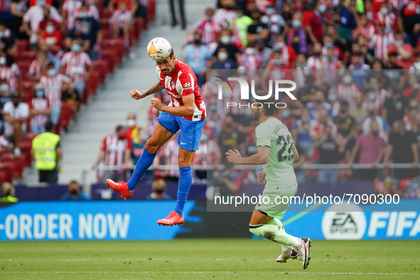 Stefan Savic of Atletico de Madrid in action with Raul Garcia of Athletic Club during the La Liga match between Atletico de Madrid and Athle...