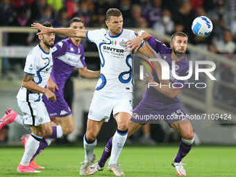 Edin Dzeko of FC Internazionale and Matija Nastasic of ACF Fiorentina compete for the ball during the Serie A match between ACF Fiorentina a...