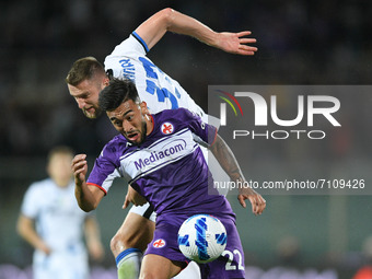 Nicolas Gonzalez of ACF Fiorentina and Milan Skriniar of FC Internazionale jump for the ball during the Serie A match between ACF Fiorentina...