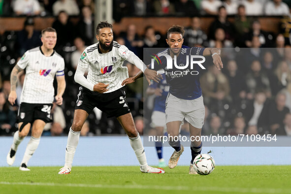 Tyler Roberts of Leeds United and Michael Hector of Fulham compete for the ball during the Carabao Cup match between Fulham and Leeds United...
