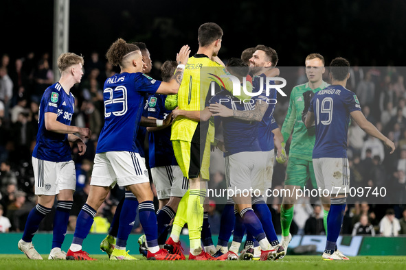 Players of Leeds United greet their goalkeeper Illan Meslier after the Carabao Cup match between Fulham and Leeds United at Craven Cottage,...