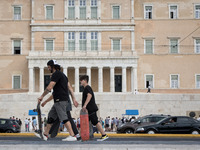 People with skateboard at Syntagma square in the center of Athens, Greece on September 22, 2021. (