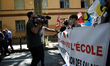 A TV crew interview protesters.Teachers on strike protested in Toulouse as other cities in...
