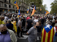 Hundreds of Catalan pro-independence activists gather in front of the Italian General Consulate in Barcelona, proctedted by police, in respo...