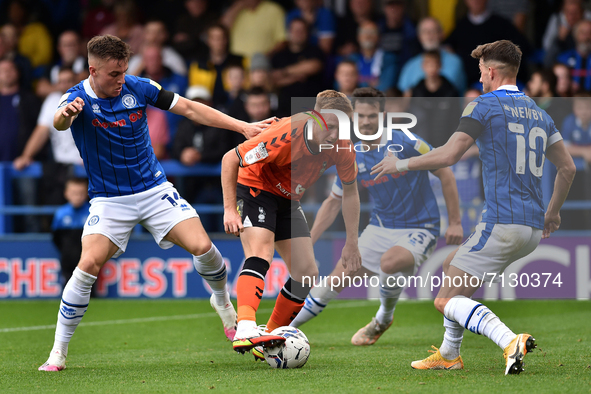 Oldham Athletic's Davis Keillor-Dunn tussles with George Broadbent of Rochdale AFC and Alex Newby of Rochdale AFC during the Sky Bet League...