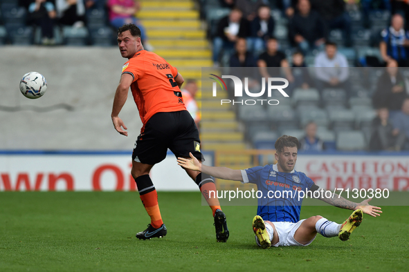 Oldham Athletic's Harrison McGahey tussles with George Broadbent of Rochdale AFC during the Sky Bet League 2 match between Rochdale and Oldh...