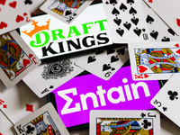 Entain and DraftKings logos displayed on phone screens are seen with playing cards in this illustration photo taken in Krakow, Poland on Sep...