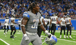 Detroit Lions running back Jamaal Williams (30) celebrates after scoring a touchdown durin...