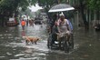 The water luggage’s KOlkata Amar Street    under heavy rain from Cyclone Komen in Kolkata...